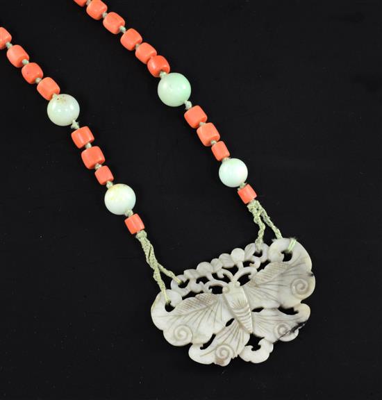 An early 20th century coral, jade and nephrite pendant necklace, 25.5in.